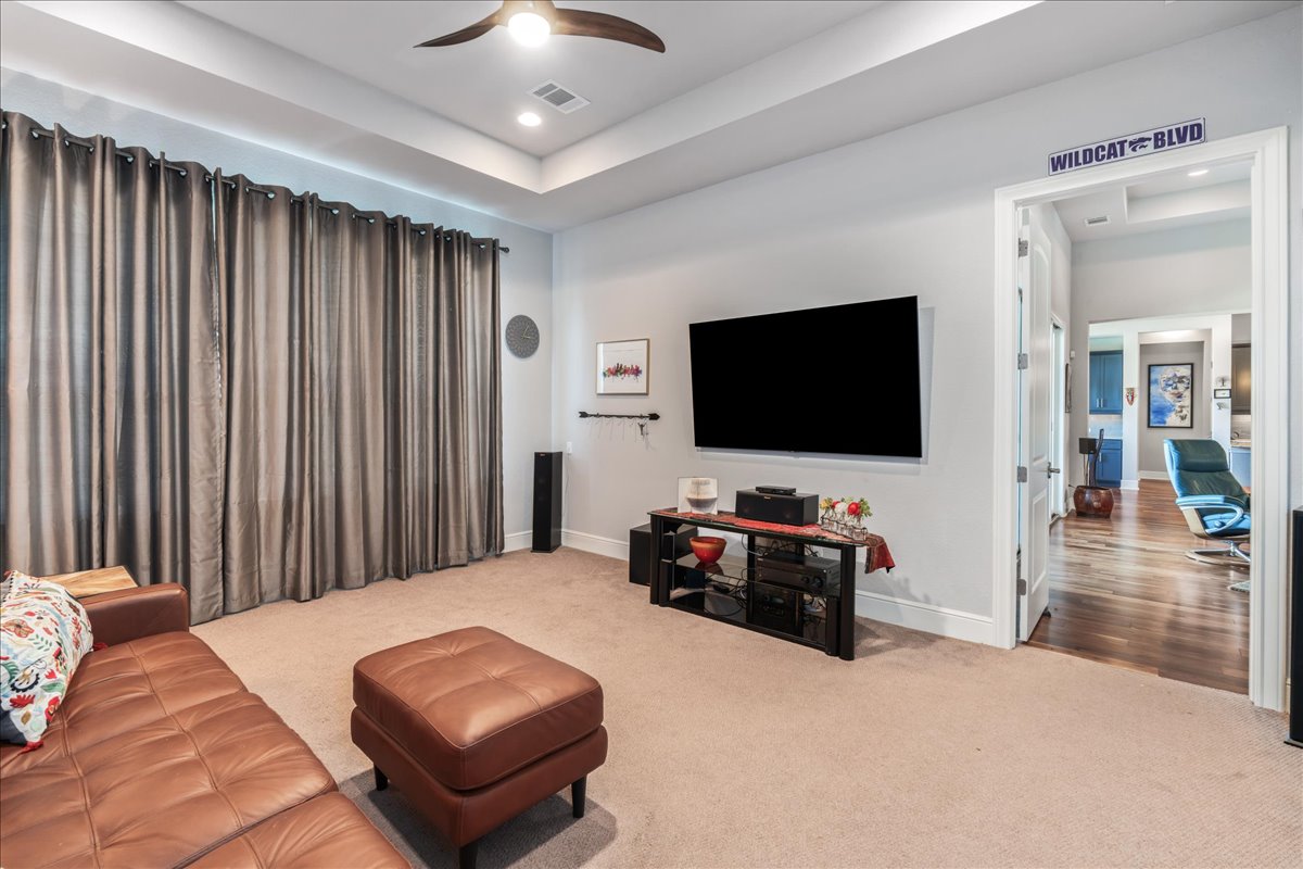 413 Montalcino Lane Georgetown, TX 78628 - Photo 27 of 40 a living room with furniture and a flat screen tv
