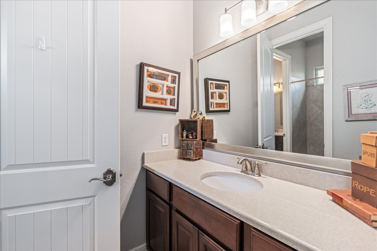 413 Montalcino Lane Georgetown, TX 78628 - Photo 29 of 40 a bathroom with a sink and a mirror
