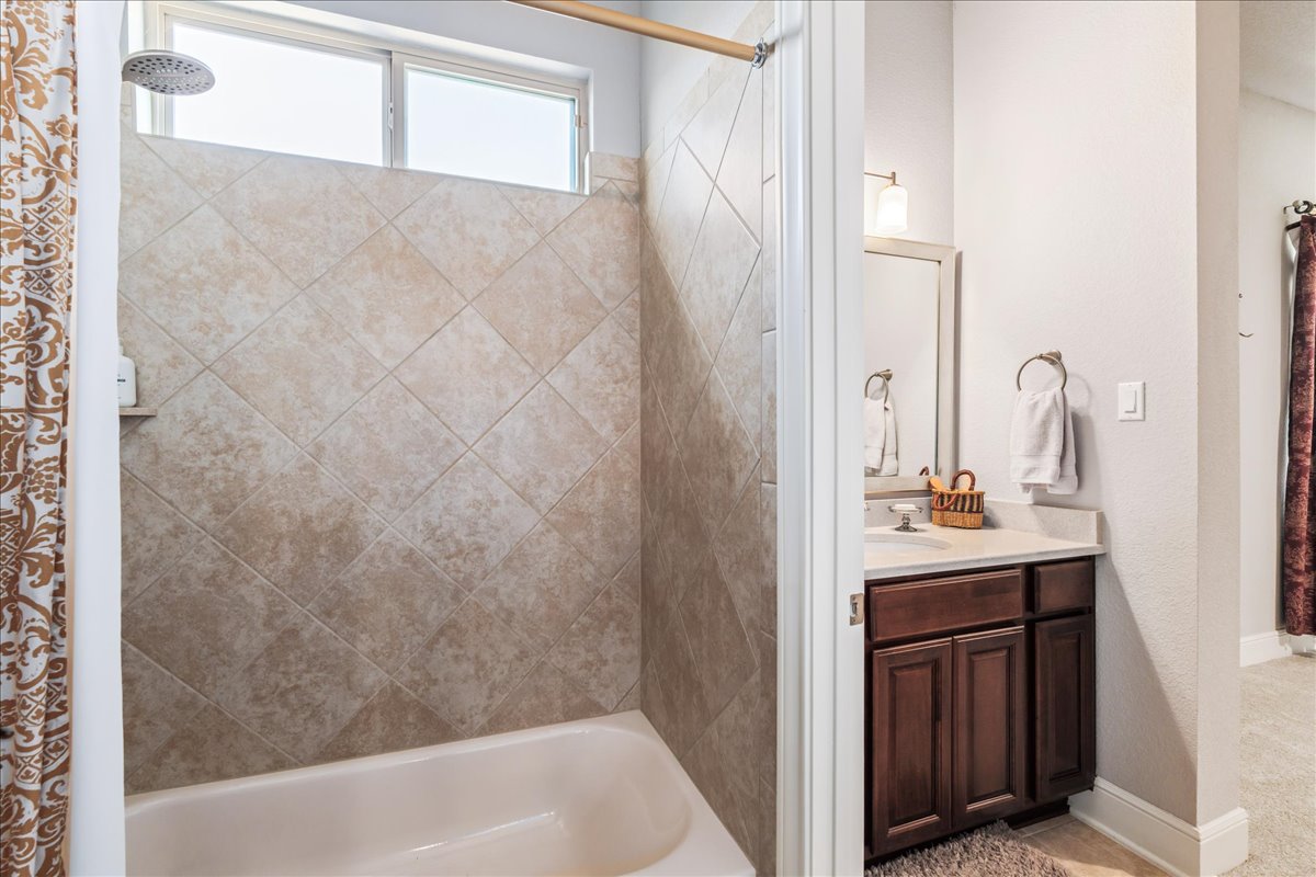 413 Montalcino Lane Georgetown, TX 78628 - Photo 30 of 40 a bathroom with a sink and a mirror