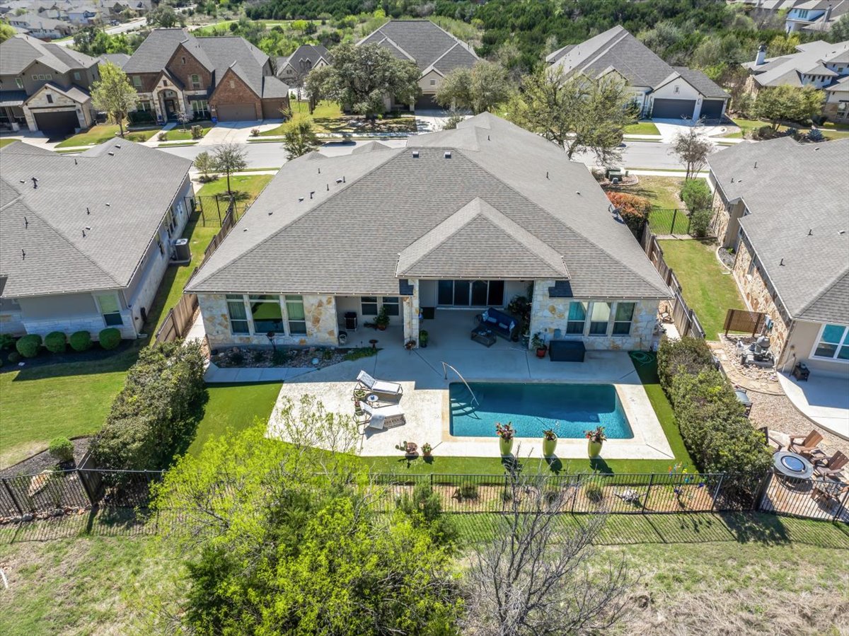 413 Montalcino Lane Georgetown, TX 78628 - Photo 3 of 40 a view of house with garden space and car parked