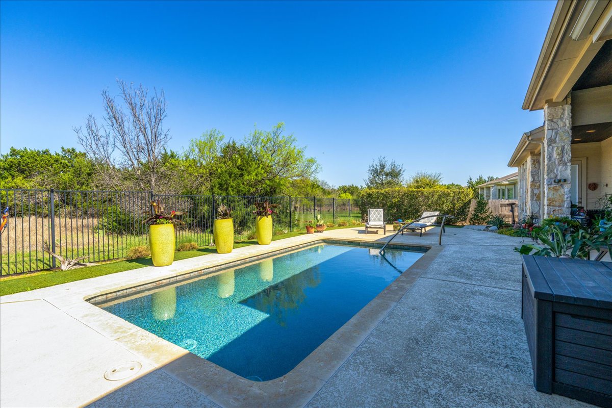 413 Montalcino Lane Georgetown, TX 78628 - Photo 37 of 40 a view of a swimming pool with a lounge chair