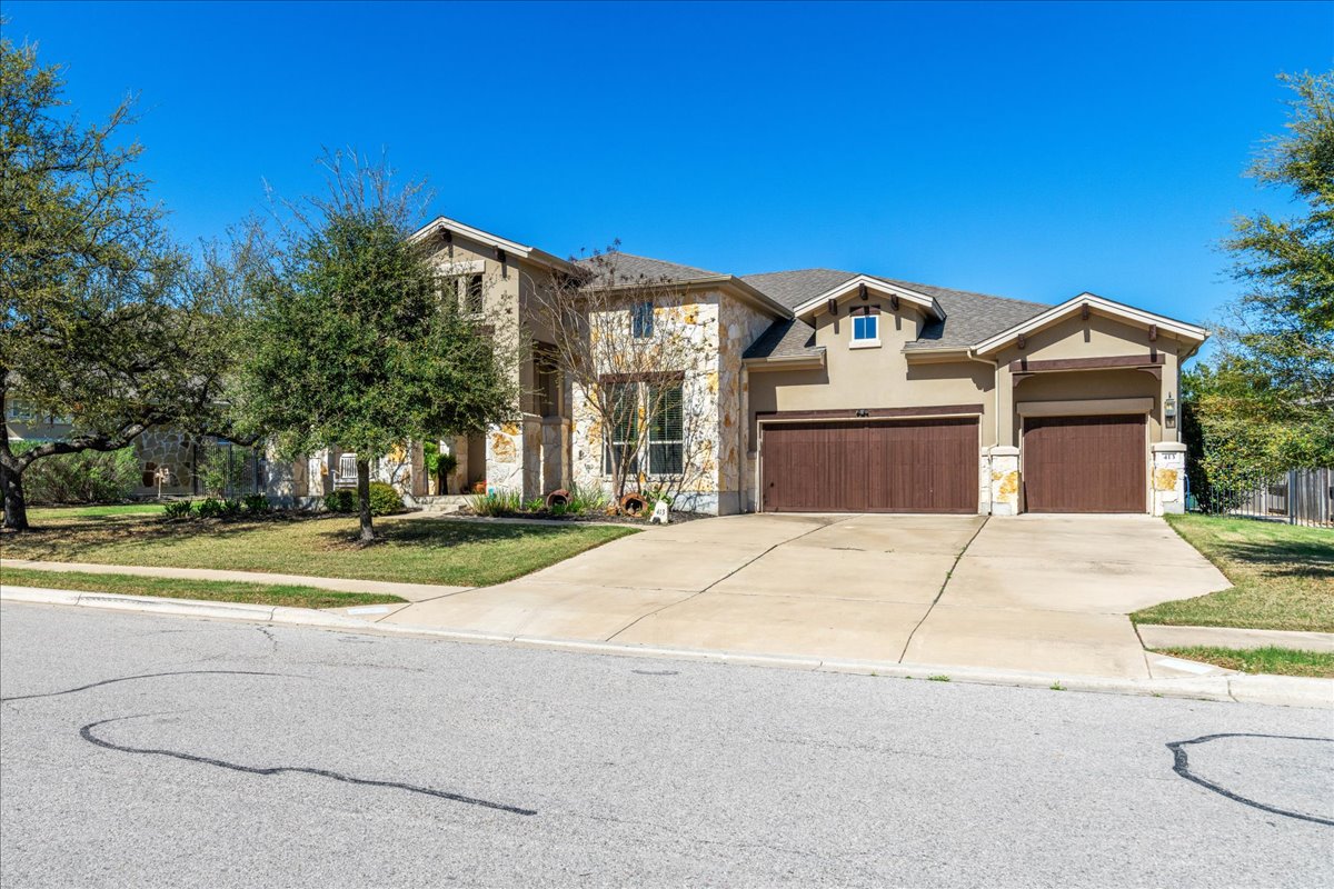 413 Montalcino Lane Georgetown, TX 78628 - Photo 4 of 40 a front view of a house with a yard
