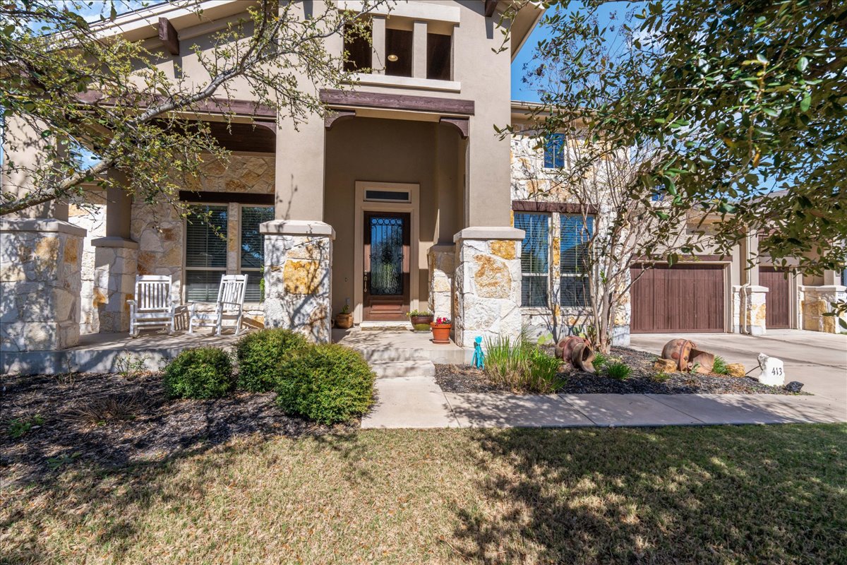 413 Montalcino Lane Georgetown, TX 78628 - Photo 5 of 40 a front view of a house with garden
