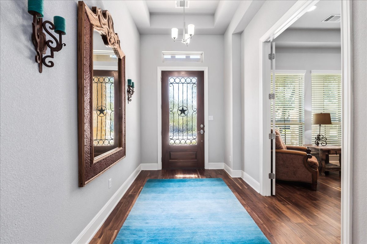 413 Montalcino Lane Georgetown, TX 78628 - Photo 6 of 40 a view of livingroom with hardwood floor and hallway