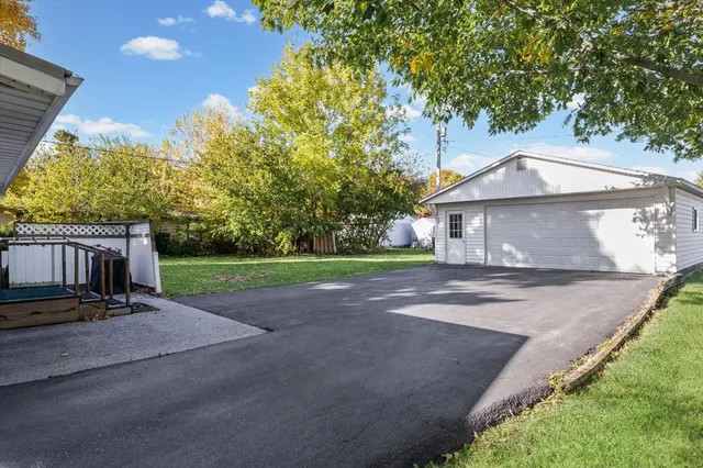 a house view with a sitting space and garden
