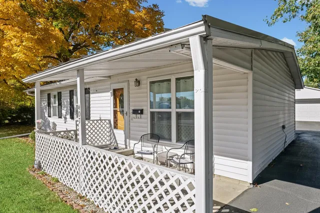 a view of a house with a backyard