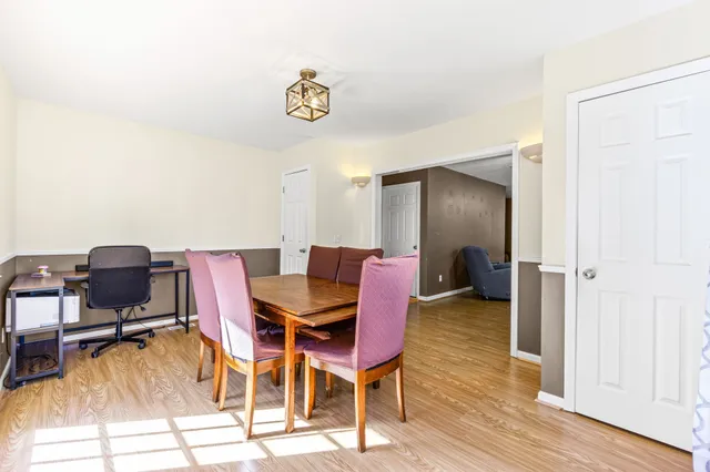a view of a livingroom with furniture and wooden floor