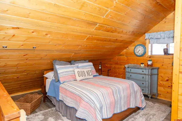 a bedroom with a bed and cabinets