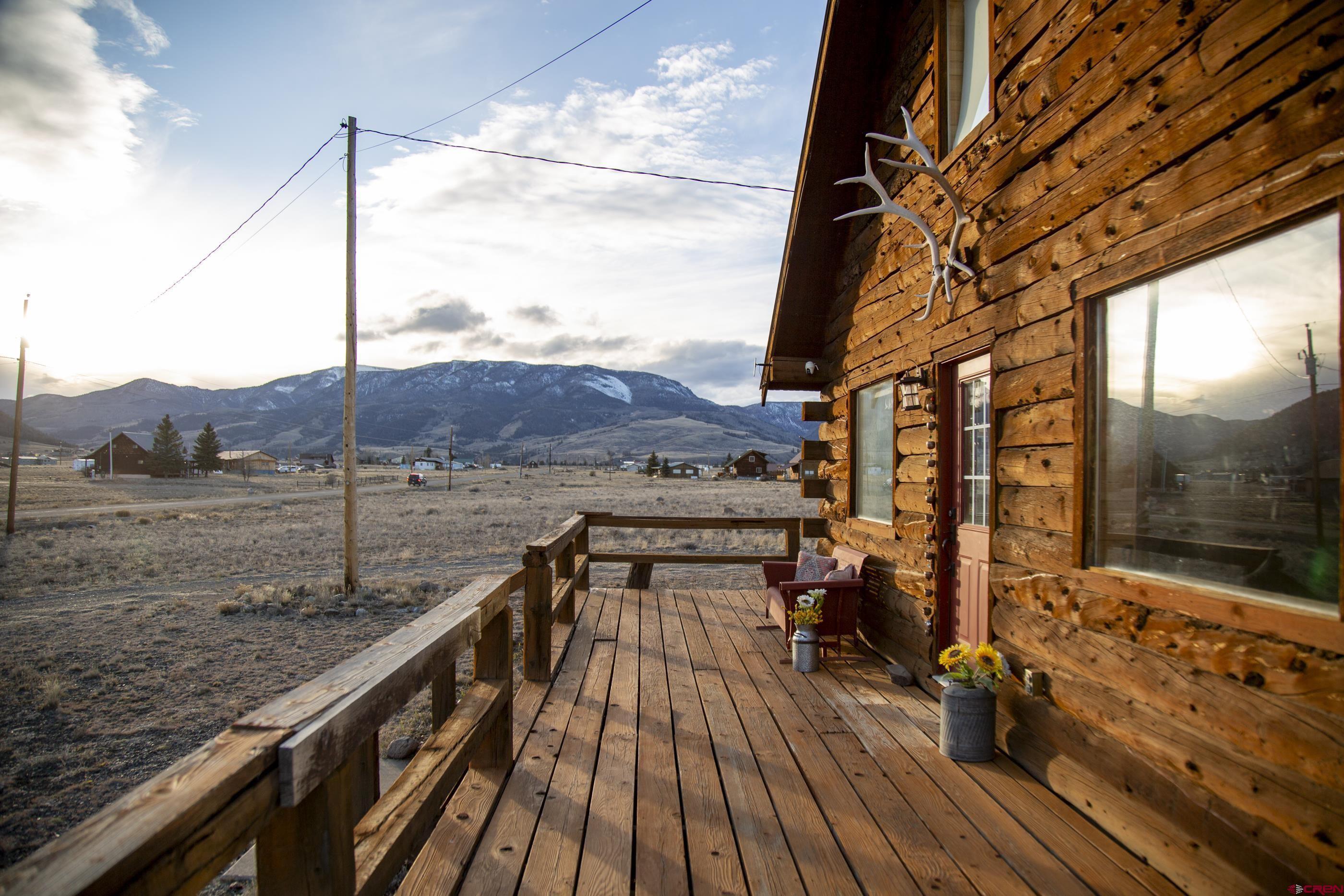 415 Ridge Drive Creede, CO 81130 - Photo 2 of 28 a view of balcony with wooden floor and outdoor seating