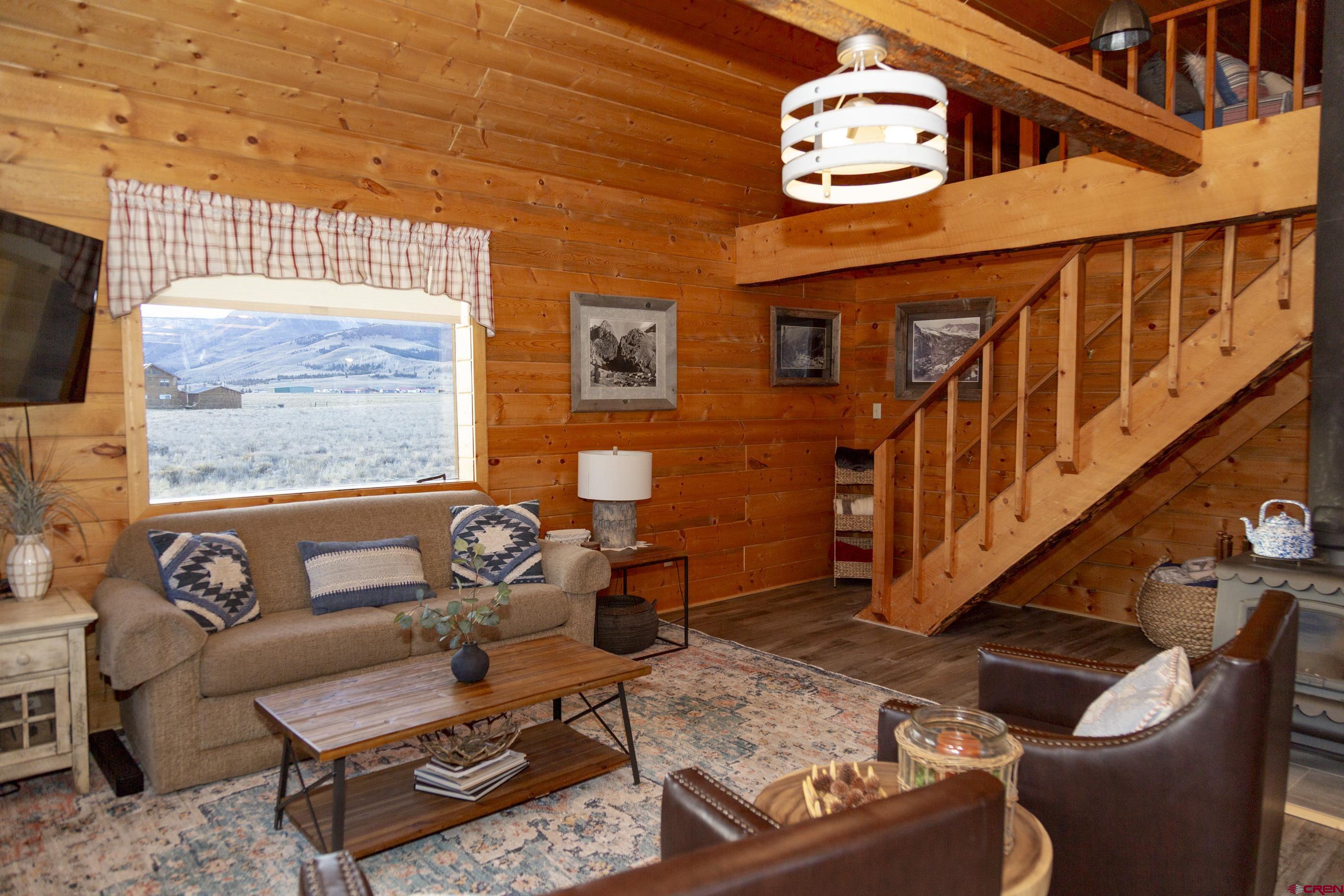 415 Ridge Drive Creede, CO 81130 - Photo 23 of 28 a living room with furniture and a window