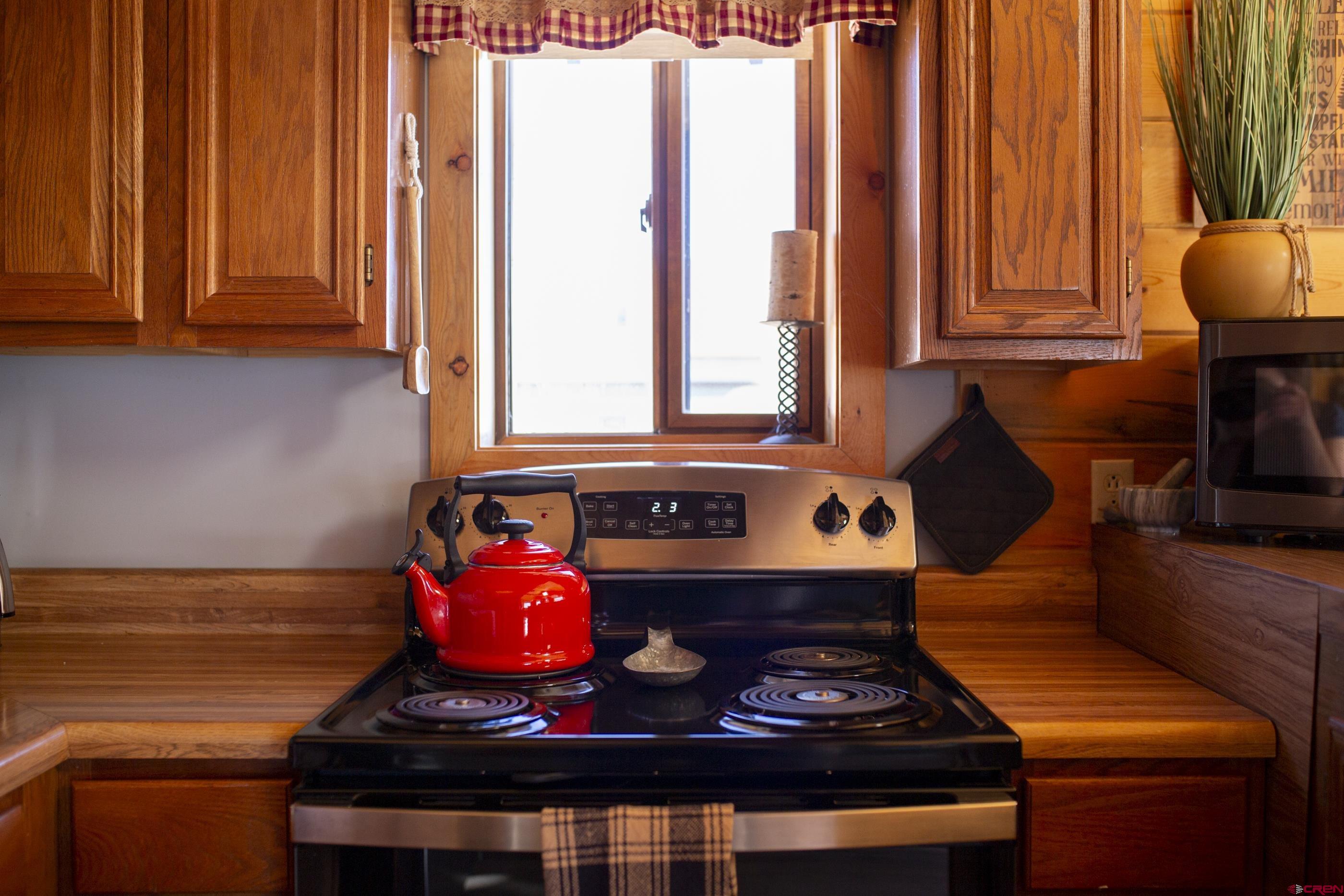 415 Ridge Drive Creede, CO 81130 - Photo 7 of 28 a stove top oven sitting inside of a kitchen