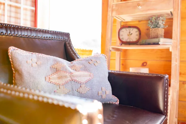 a living room with a bed