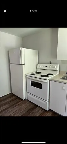 a kitchen with a stove and a refrigerator