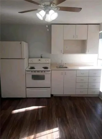a view of a kitchen with cabinets