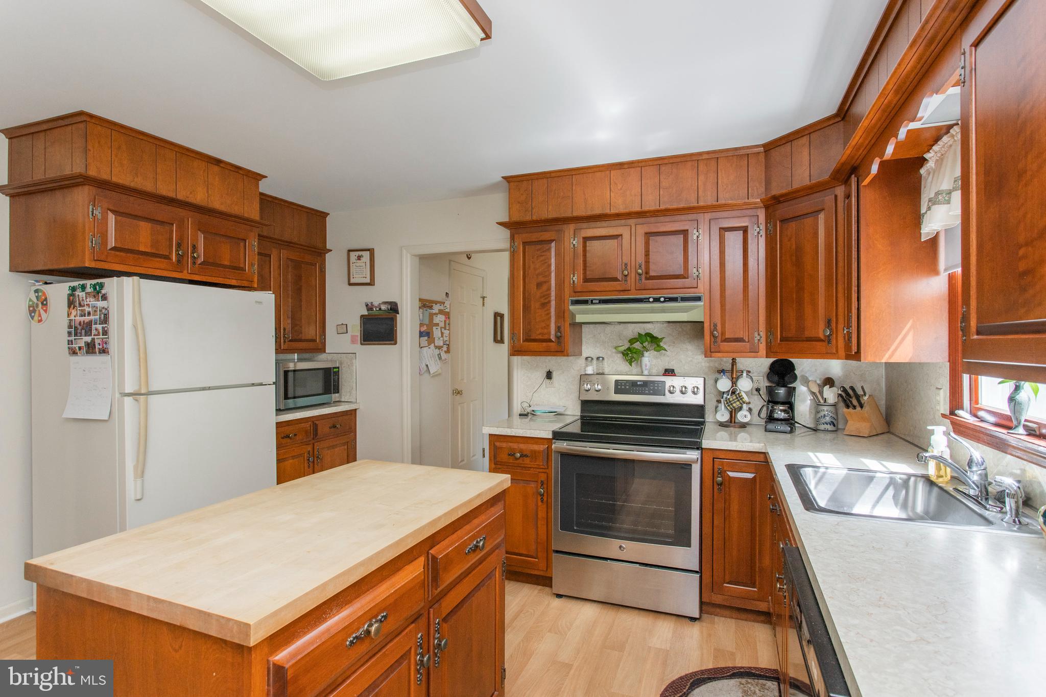 154 Poplar Road Newtown Square, PA 19073 - Photo 16 of 56 Kitchen island provides extra counter space.