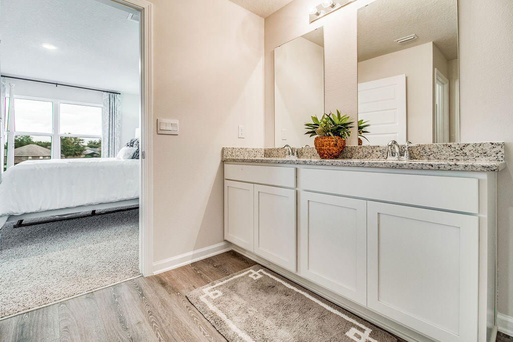 2851 Patriot Ridge Way Crestview, FL 32539 - Photo 16 of 34 a bathroom with a sink and a mirror