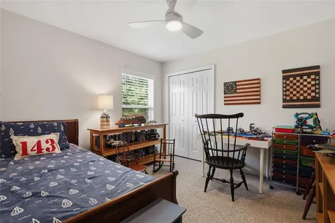 a bedroom with furniture and a window