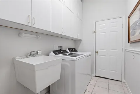 a view of storage and utility room with washer and dryer