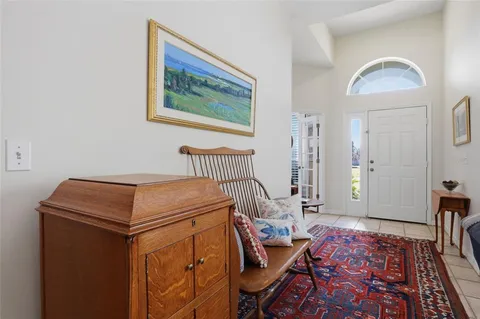 a bedroom with furniture and wooden floor