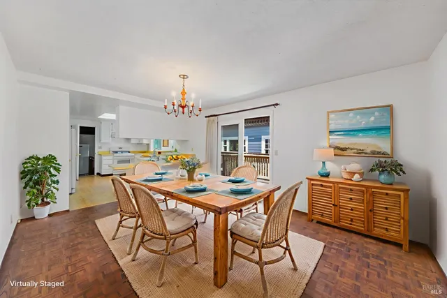a view of a kitchen with a sink and a refrigerator