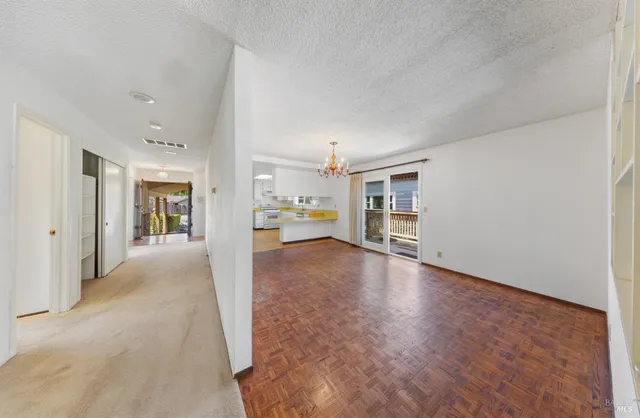 a living room with furniture a fireplace and a large window