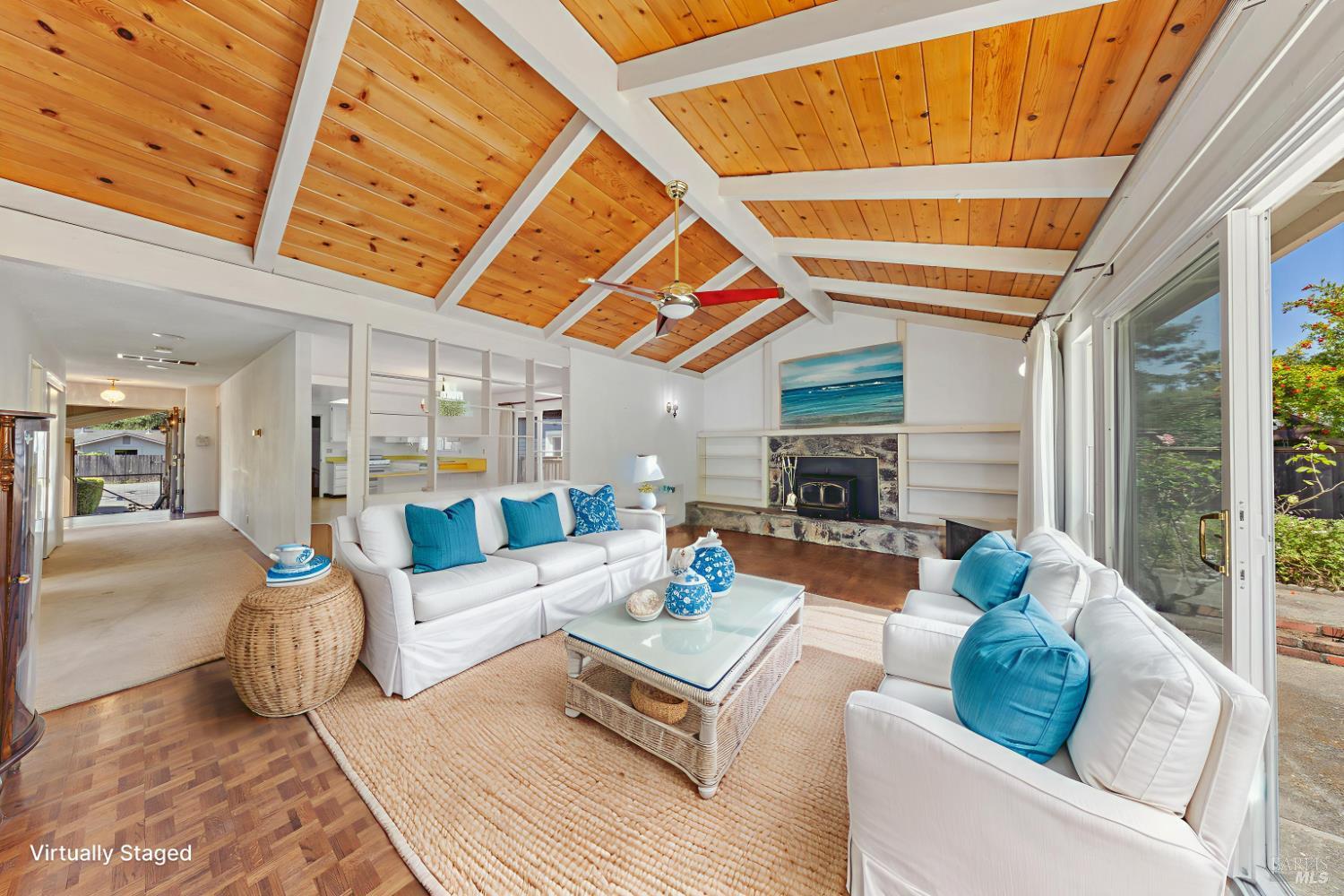 32 Roosevelt Avenue San Rafael, CA 94903 - Photo 16 of 40 a living room with furniture a fireplace and a large window