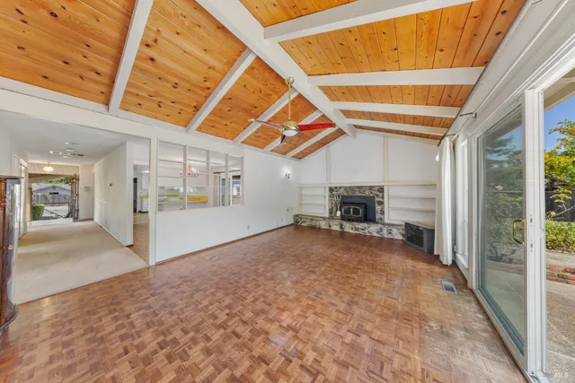 a living room with furniture fireplace and a flat screen tv