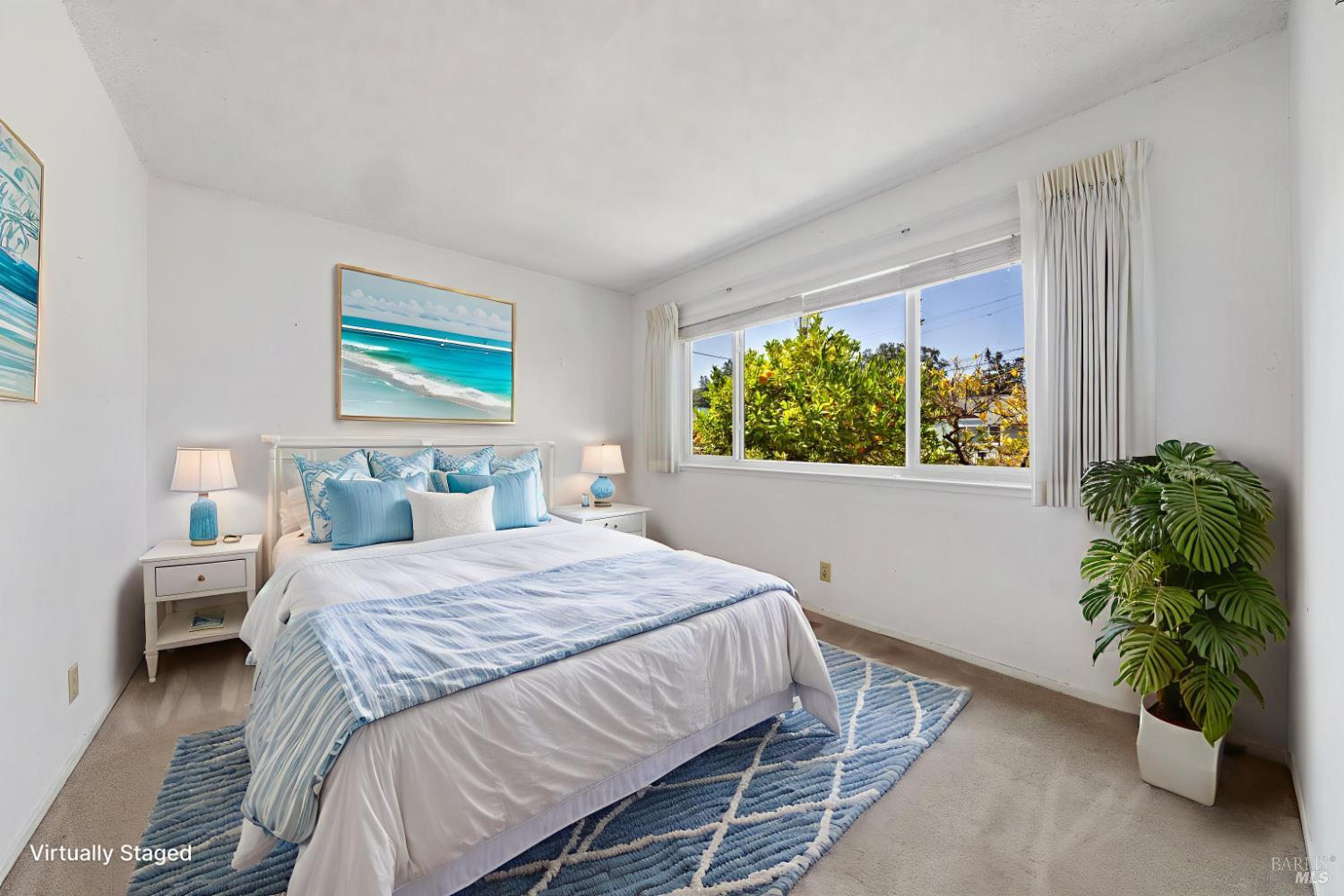 32 Roosevelt Avenue San Rafael, CA 94903 - Photo 26 of 40 a bedroom with a bed and a potted plant