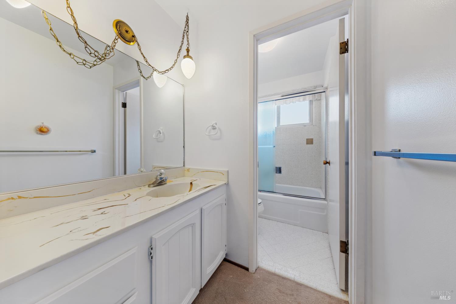 32 Roosevelt Avenue San Rafael, CA 94903 - Photo 28 of 40 a bathroom with a sink and mirror with bathtub