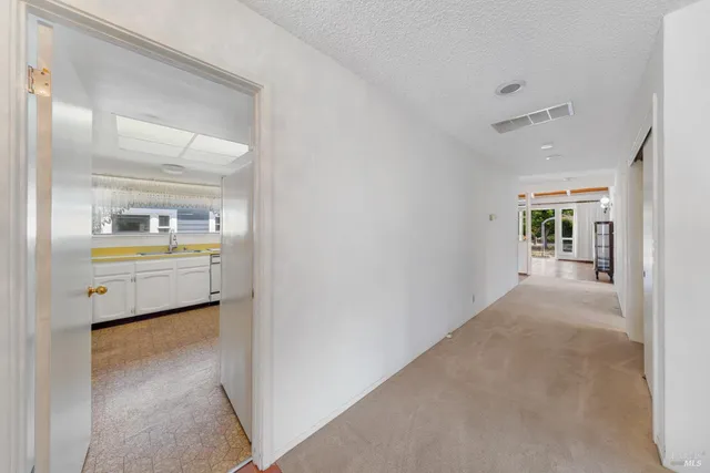 a kitchen with stainless steel appliances granite countertop a sink and cabinets