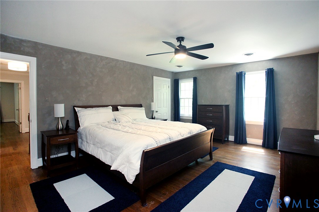 231 Hazelmere Drive Chesterfield, VA 23236 - Photo 18 of 33 a bedroom with a bed and a chandelier