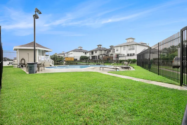 a swimming pool with a yard