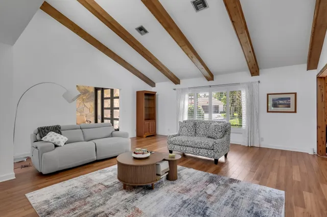 an empty room with potted plants