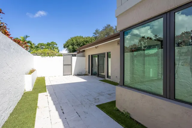 a room with gym equipment and wooden floor