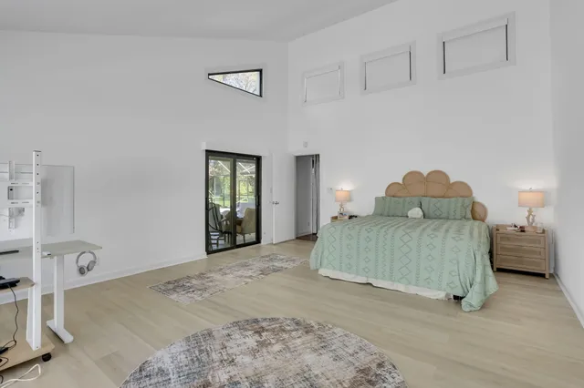 a view of a bathroom with a shower and a window