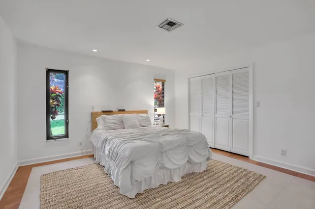 an aerial view of a house with a garden and swimming pool