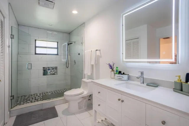a view of a patio with a table and chairs