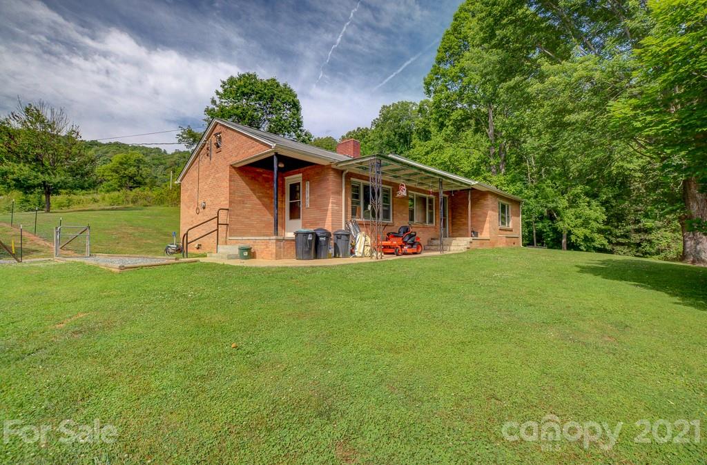 232 P P V Road Clyde, NC 28721 - Photo 13 of 22 a front view of a house with garden