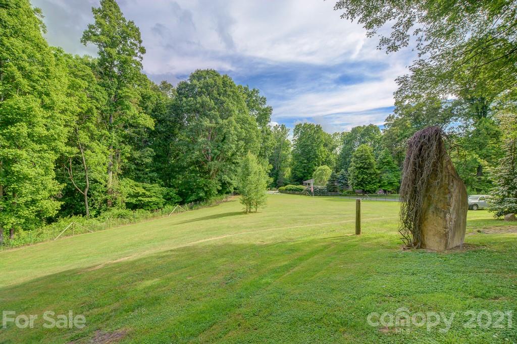 232 P P V Road Clyde, NC 28721 - Photo 17 of 22 a backyard of a house with lots of green space