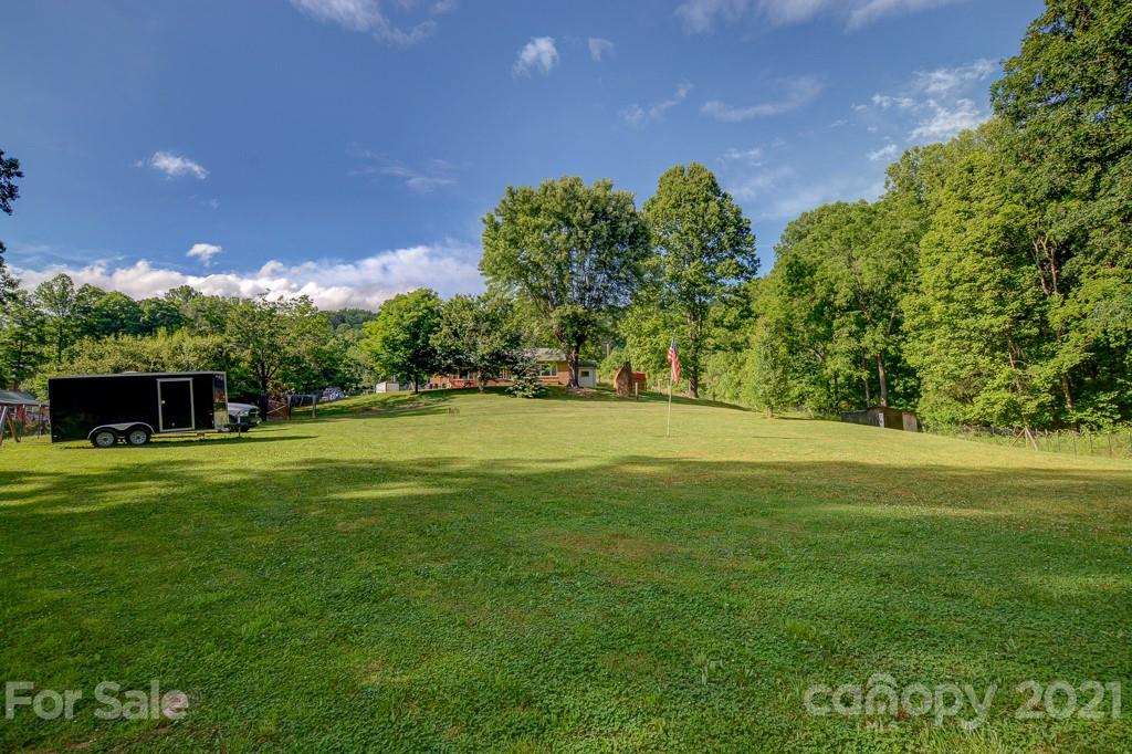 232 P P V Road Clyde, NC 28721 - Photo 20 of 22 a view of a golf course with a garden