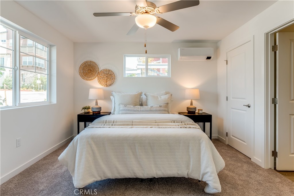 3802 Ranch House Road, Unit 103 San Luis Obispo, CA 93401 - Photo 2 of 9 a bedroom with a bed and window