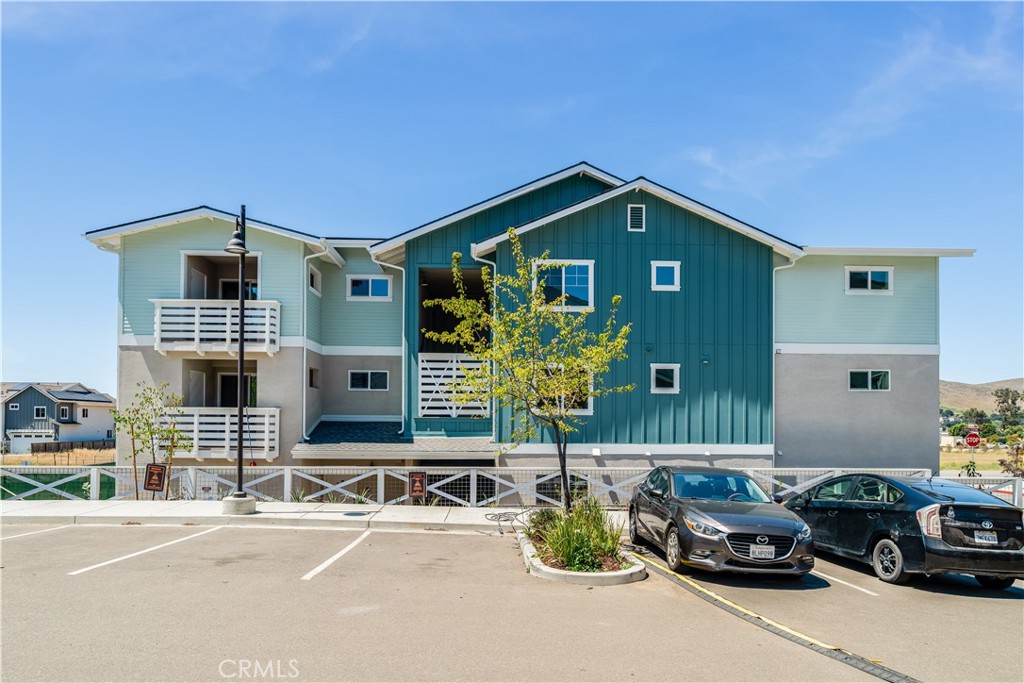 3802 Ranch House Road, Unit 103 San Luis Obispo, CA 93401 - Photo 1 of 9 a front view of a house with parking