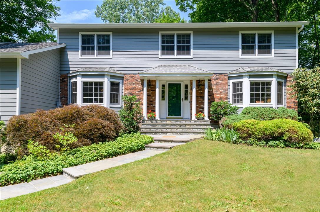 a view of a house with a garden