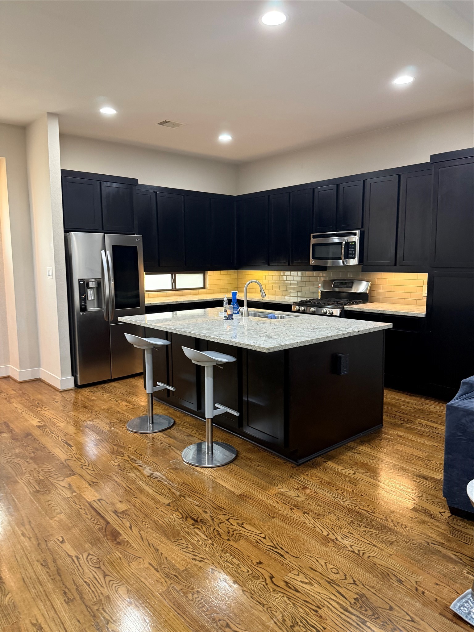 1007 Roberts Street Houston, TX 77003 - Photo 7 of 11 a kitchen with stainless steel appliances granite countertop a sink and a stove