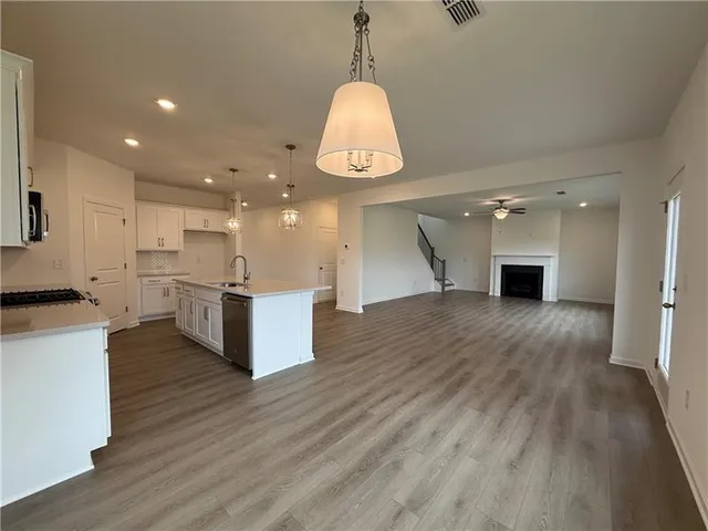 a view of kitchen with cabinets and wooden floor
