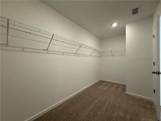 a bathroom with a double vanity sink and mirror