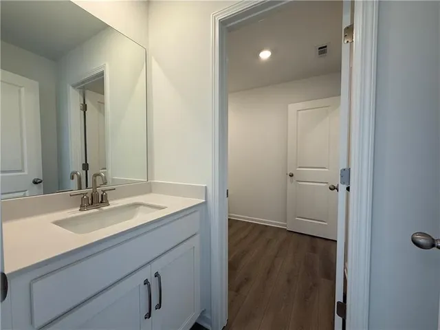 a bathroom with a tub and shower