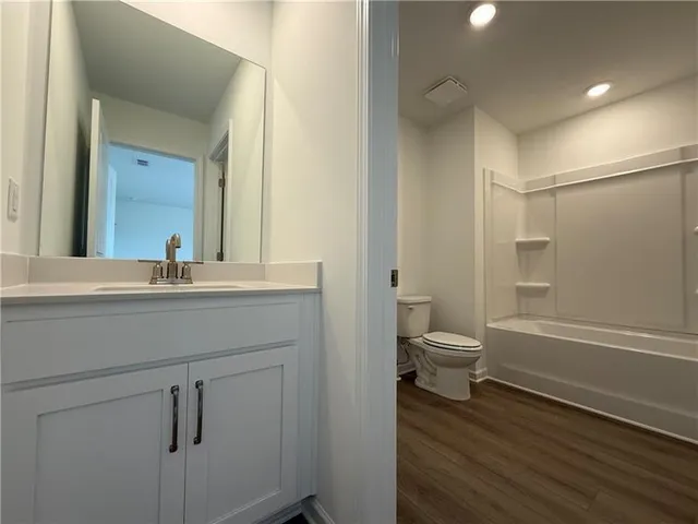 an empty room with a empty space and windows