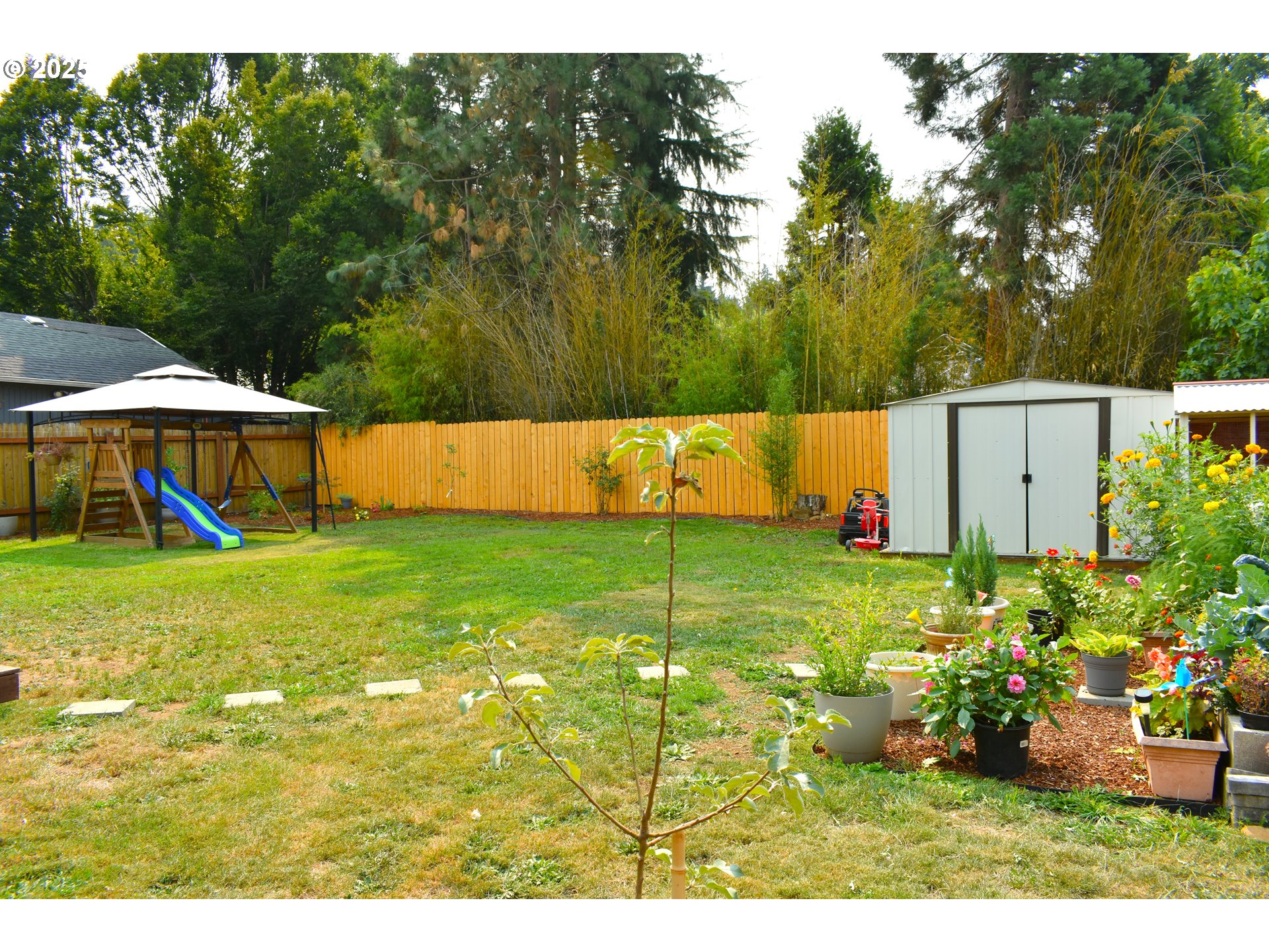 1727 East Washington Avenue Cottage Grove, OR 97424 - Photo 14 of 20 a view of a house with a yard and sitting area