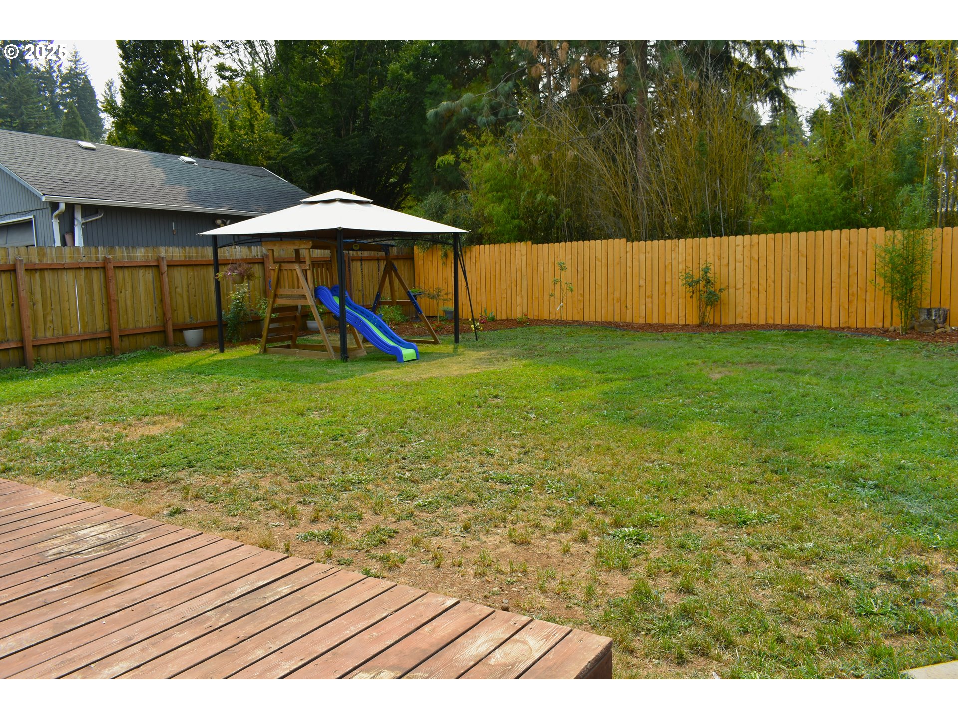 1727 East Washington Avenue Cottage Grove, OR 97424 - Photo 17 of 20 a view of swimming pool with a table and chairs under an umbrella
